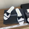 CHANEL BOW SLIPPERS IN WHITE LAMBSKIN
