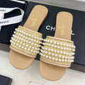 CHANEL FLAT SLIDE IN FLAX YELLOW CALFSKIN WITH PEARLS